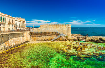 Scenic view of sea against blue sky