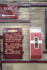 Close-up of text on brick wall