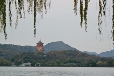 View of a lake with temple in the background