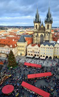 High angle view of people by church of our lady before tyn in town square