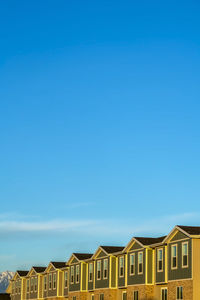 Low angle view of building against blue sky