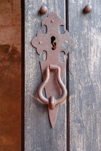 Close-up of carving on metal door