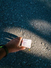 Low section of person standing on road