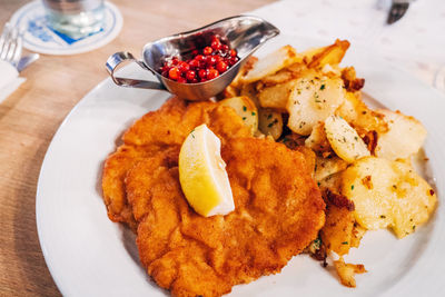 Close-up of food with cranberry sauce in plate on table