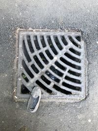 High angle view of manhole on street