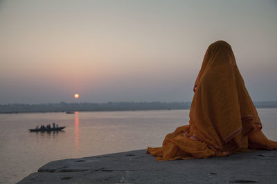 Scenic view of sea against clear sky during sunset