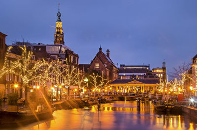 Canal and town hall in leiden, holland, by night