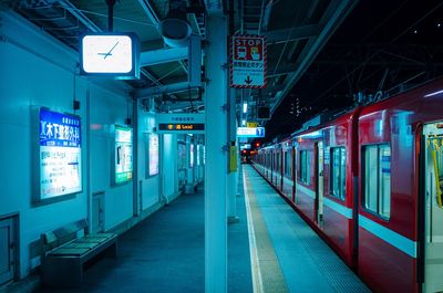 Train at railroad station at night