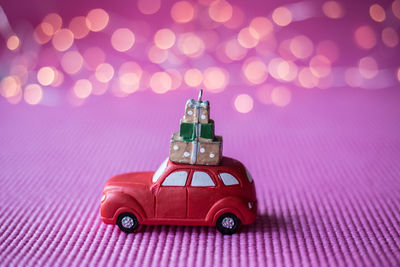 Close-up of toy car on purple fabric