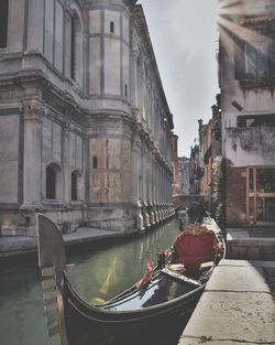 View of canal amidst buildings in city of venice