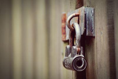 Close-up of metal padlock on door