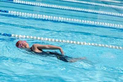 Girl swimming in pool