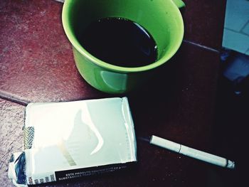 High angle view of coffee cup on table