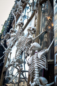 Low angle view of statue against historic building