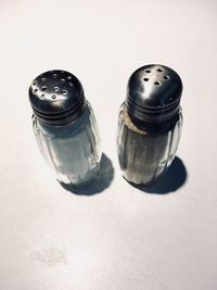High angle view of salt and pepper on table