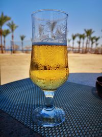 Close-up of beer glass on table