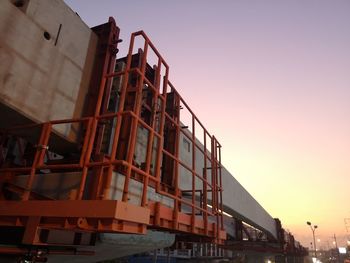 Low angle view of construction site against clear sky