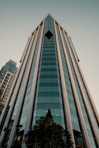 Low angle view of modern buildings against sky