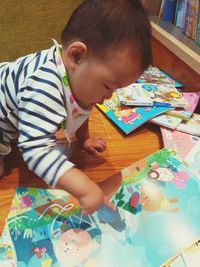 High angle view of baby boy on table at home