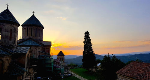 Historic building against sky during sunset