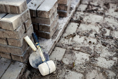 View of new paving slabs and concrete blocks on summer day at construction site. stone blocks stand