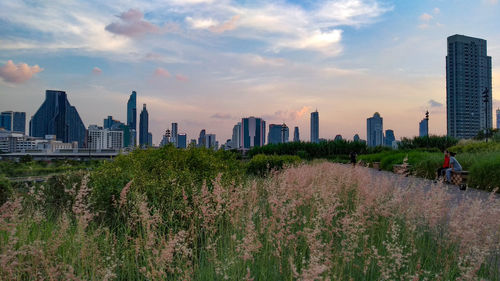 Panoramic view of city buildings against sky during sunset