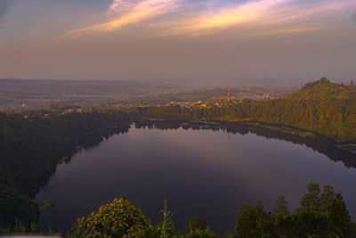 Scenic view of lake against sky during sunset