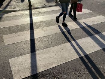 Low section of people crossing road