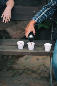 Close-up of man holding coffee cup