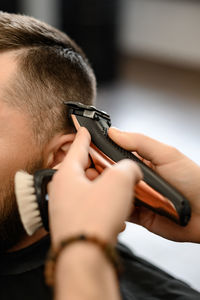 Close-up of man using mobile phone