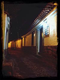 Illuminated walkway at night