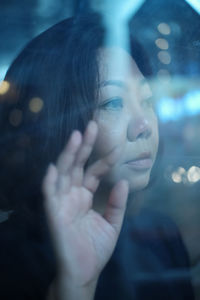 Close-up portrait of woman looking away