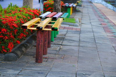 Close-up of multi colored umbrellas on footpath