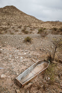 Scenic view of arid landscape against sky