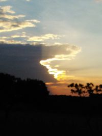 Scenic view of silhouette landscape against sky during sunset