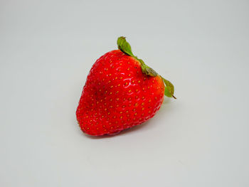 Close-up of strawberry against white background