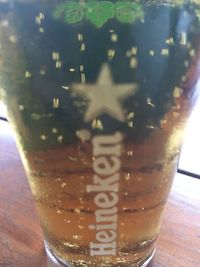 Close-up of beer glass on table