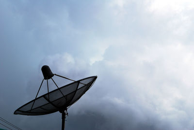 Low angle view of communications tower against sky