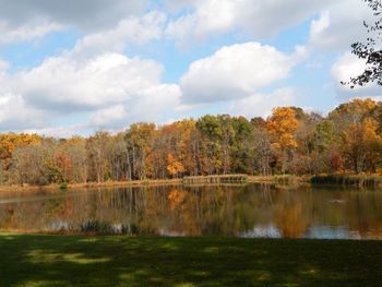 Scenic view of lake against trees during autumn