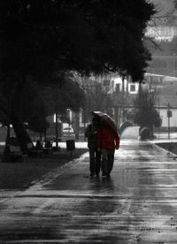 Blurred motion of people walking on road