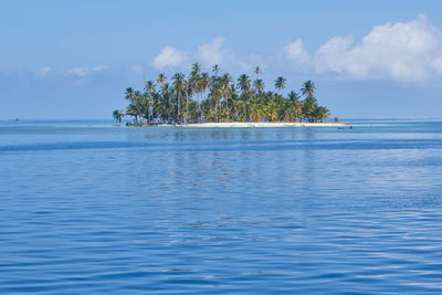 Scenic view of sea against blue sky