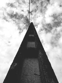 Low angle view of building against cloudy sky