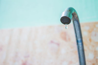 Close-up of faucet in swimming pool