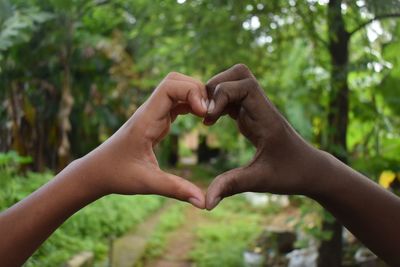 Black and white hands in heart shape, interracial friendship. black lives matter.