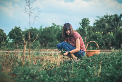 Woman sitting on field