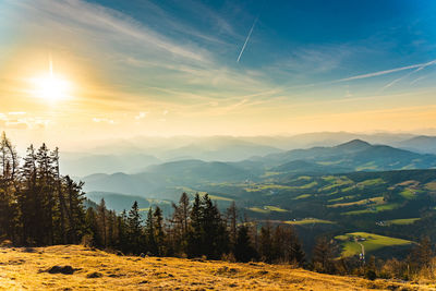 Scenic view of landscape against sky during sunset