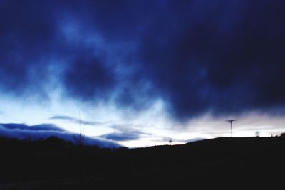 Silhouette landscape against sky