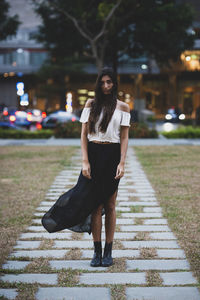 Full length of woman on street in city