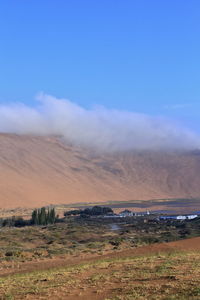 Scenic view of land against sky