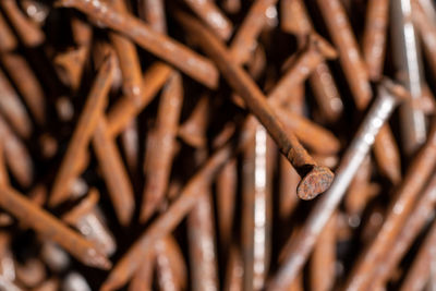 Full frame shot of rusty metal on wood